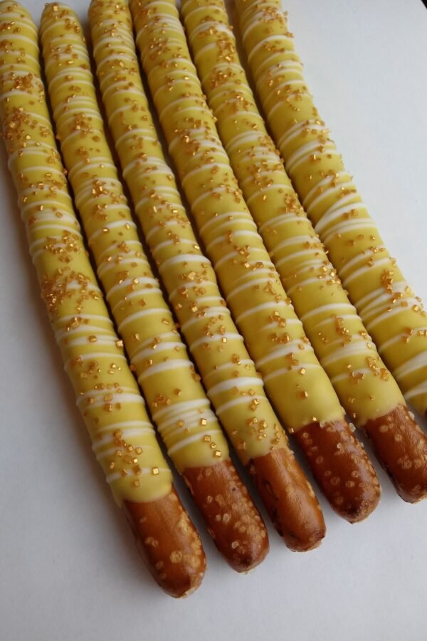 12 Yellow Chocolate Covered Pretzels With White Drizzle & Gold Sprinkles